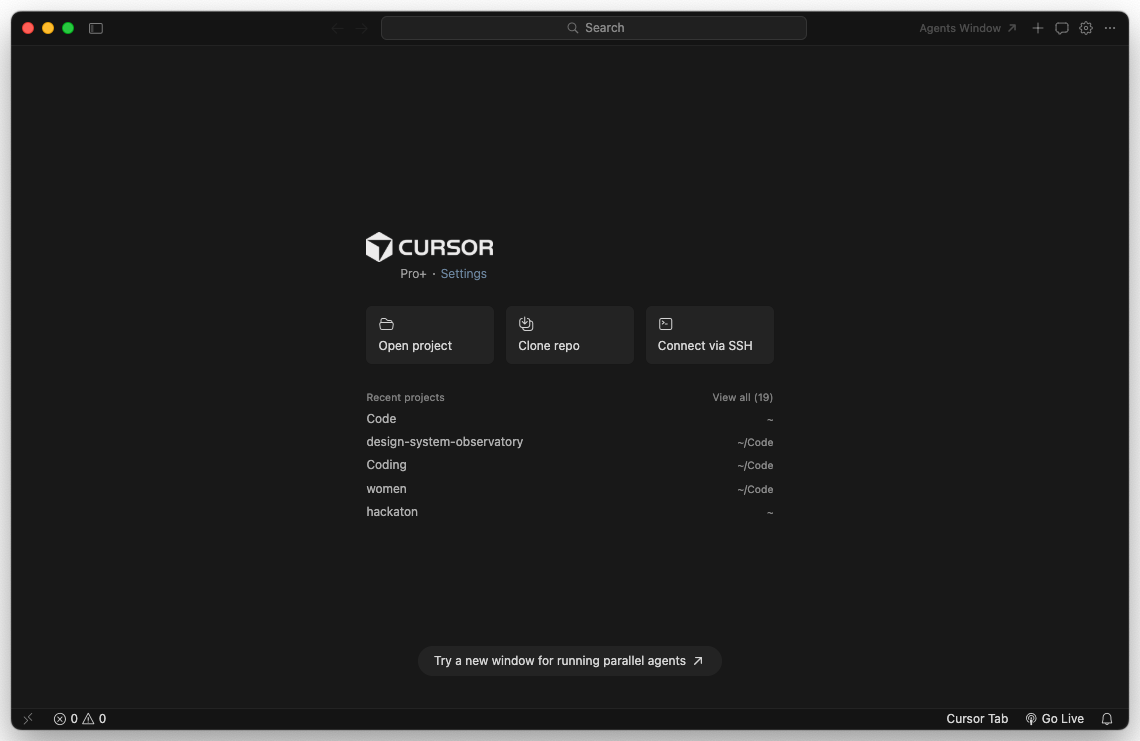 Cursor first-load screen, a VS Code-style window with the AI chat panel docked on the right and a sign-in or welcome state in the center.